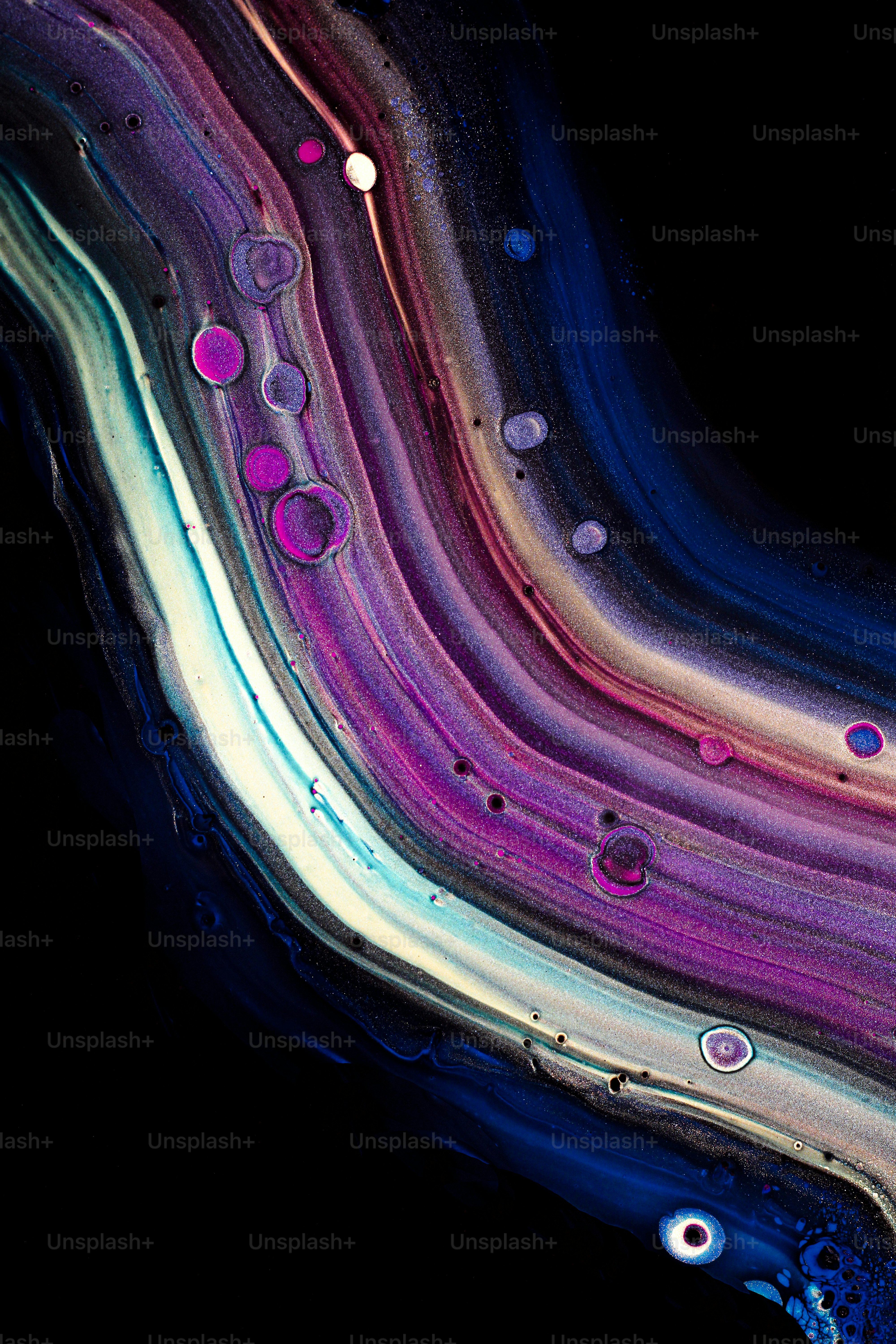 a close up of a black background with different colors