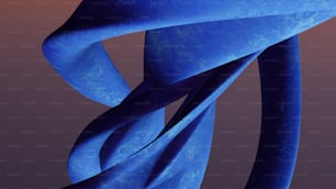a blue sculpture is shown against a dark background