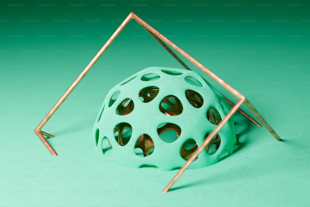 a green ball with holes in the middle of it