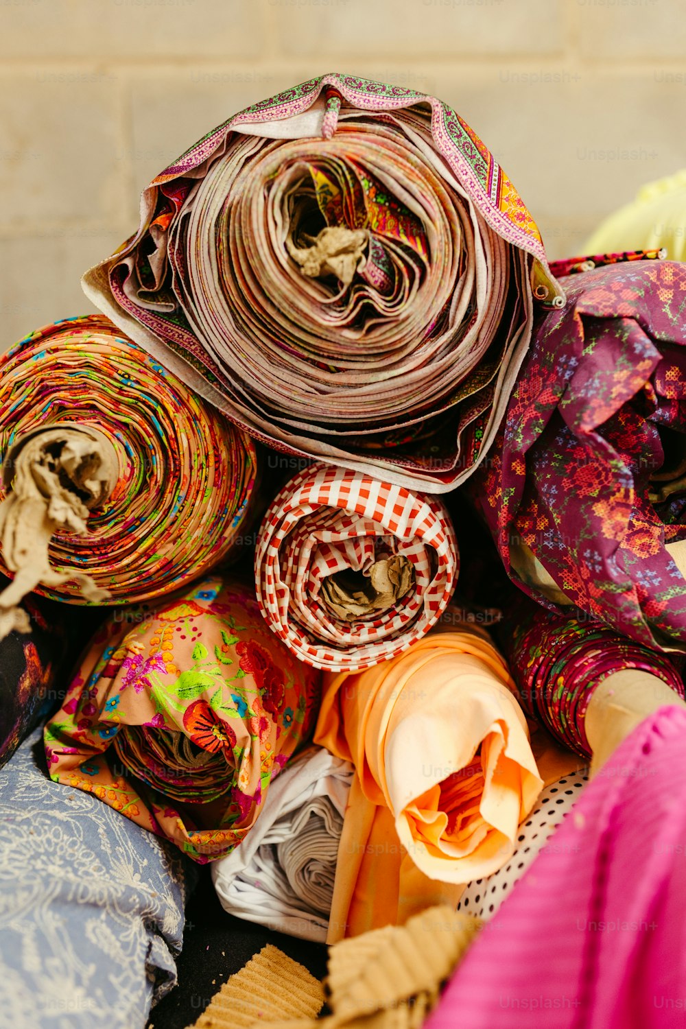 a pile of scarves sitting on top of a table