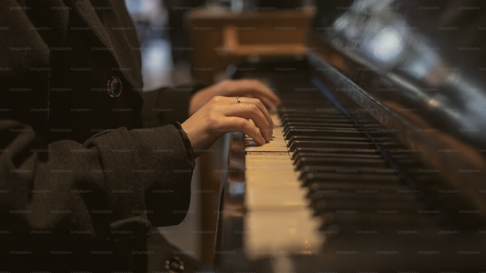 a close up of a person playing a piano