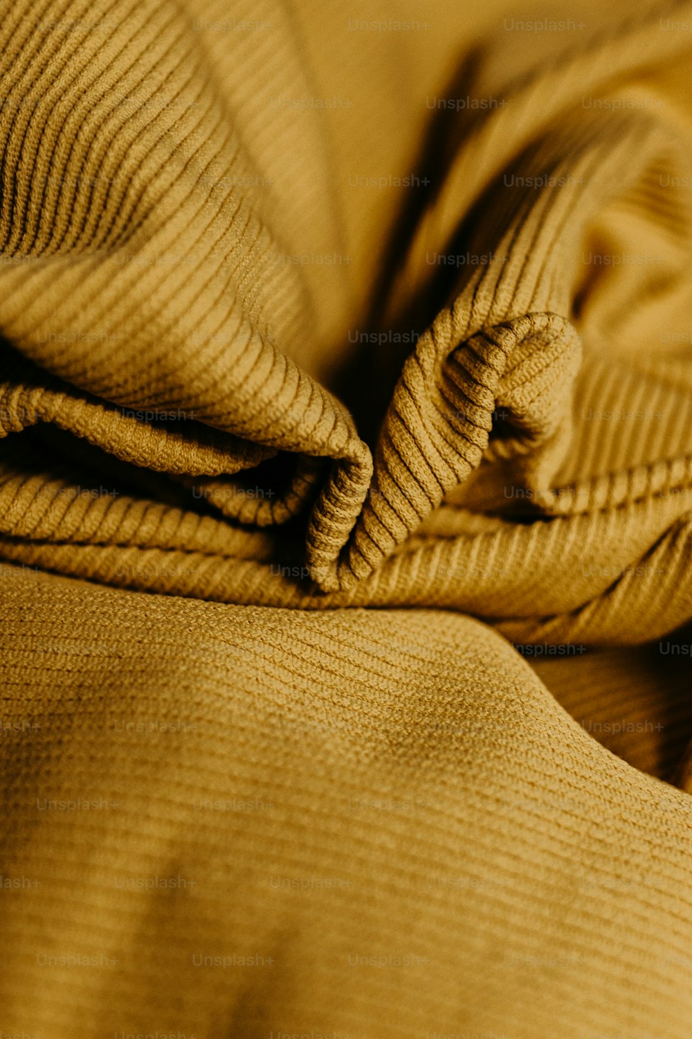 a close up of a blanket on a bed