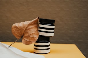 a couple of vases sitting on top of a table