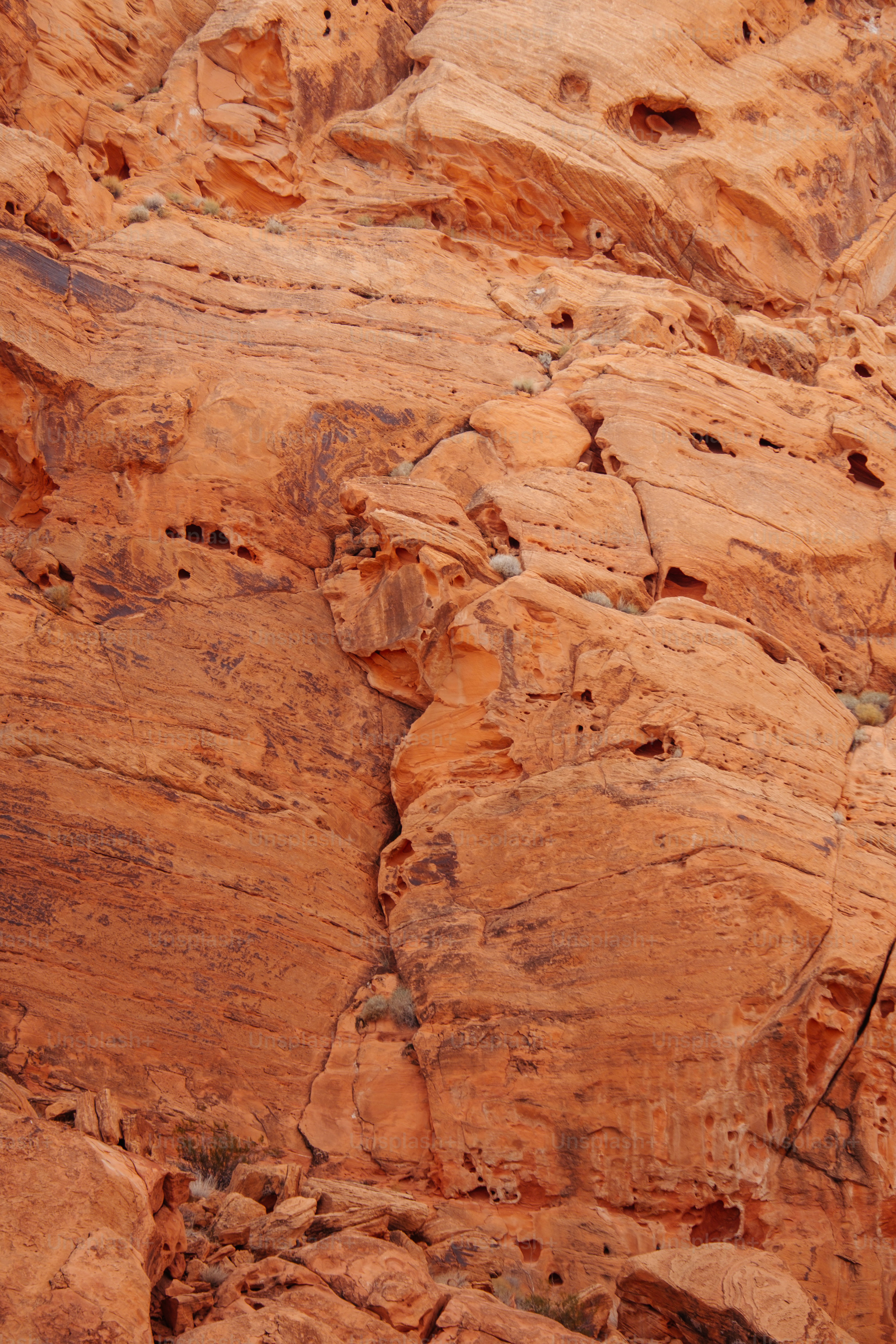 a man climbing up the side of a mountain