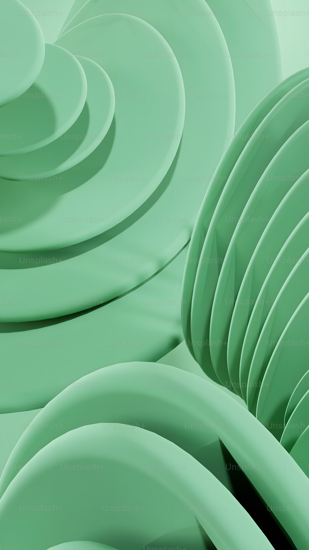 a stack of green plates stacked on top of each other