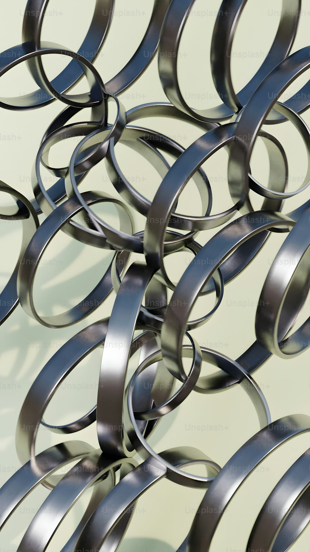 a group of metal rings on a white surface