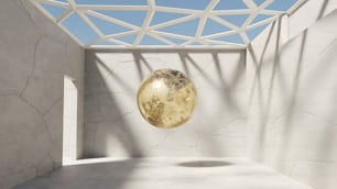 uma bola dourada pendurada em um teto em uma sala