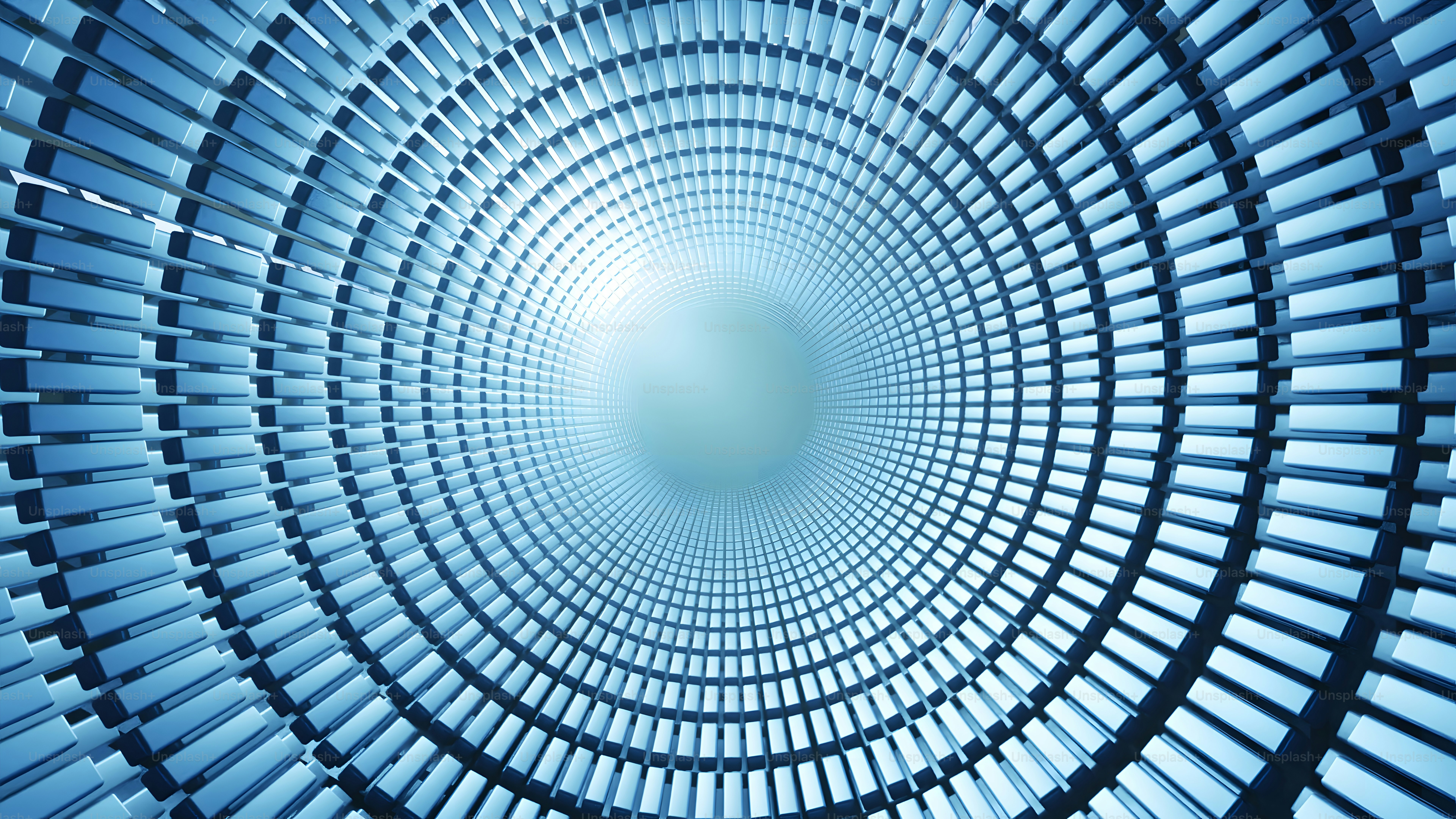 A very large circular structure with a blue sky in the background photo ...