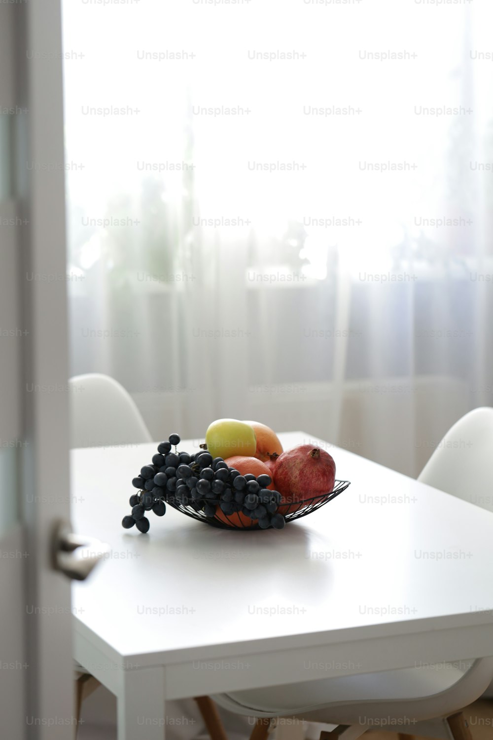 a bowl of fruit is sitting on a table