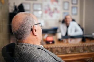 a man sitting in a chair in front of a tv