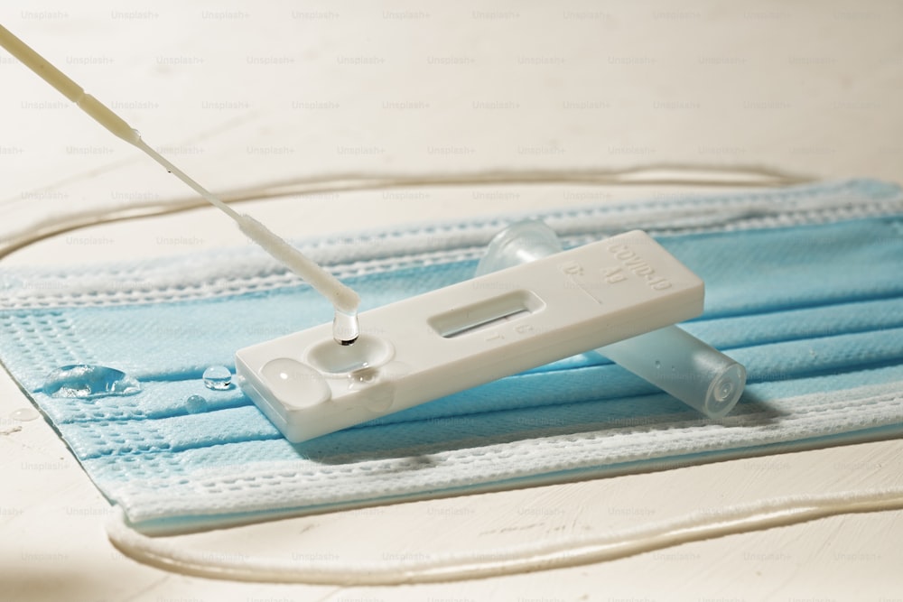 a pair of scissors and a blue cloth on a table