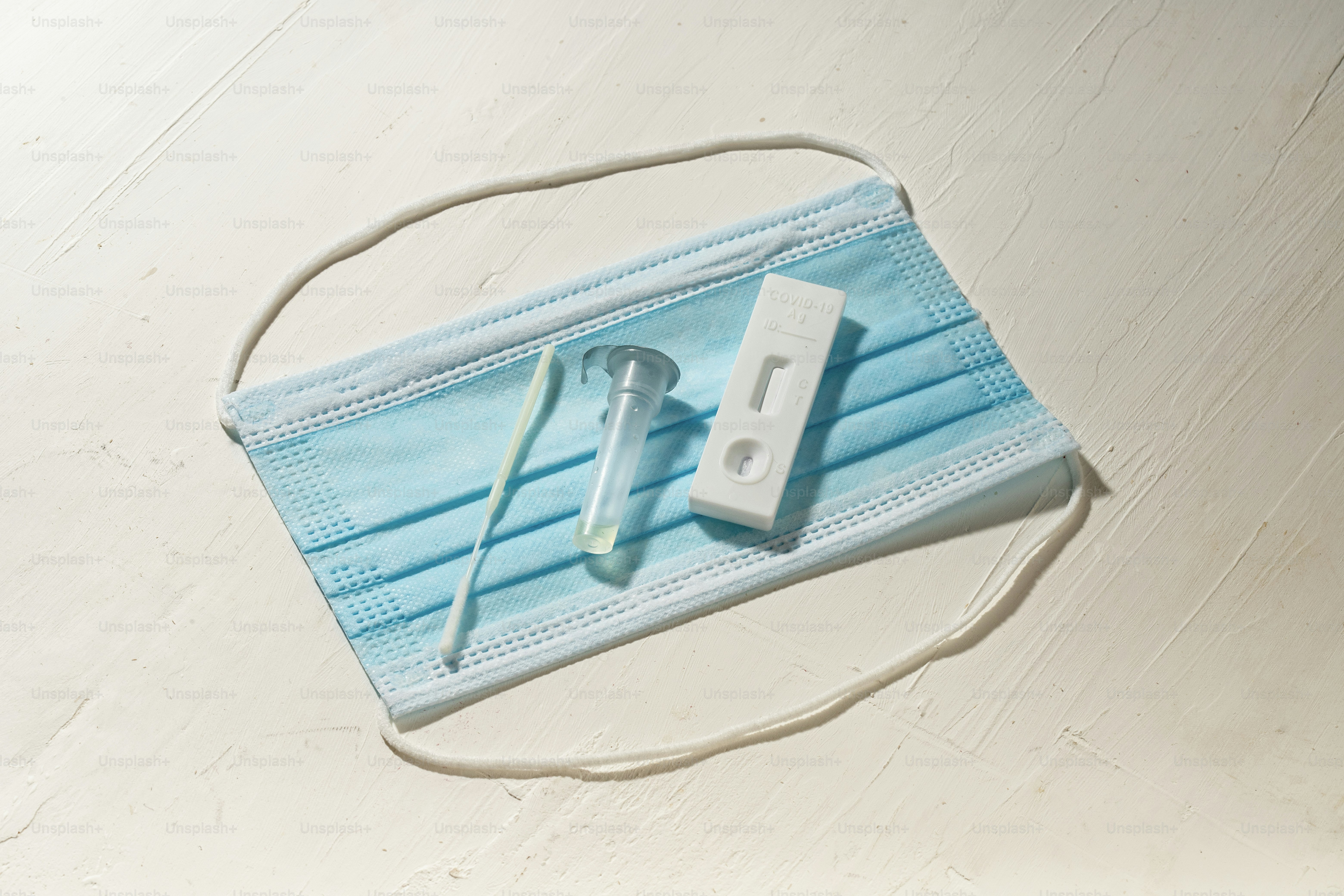 a medical mask with a pair of scissors on it