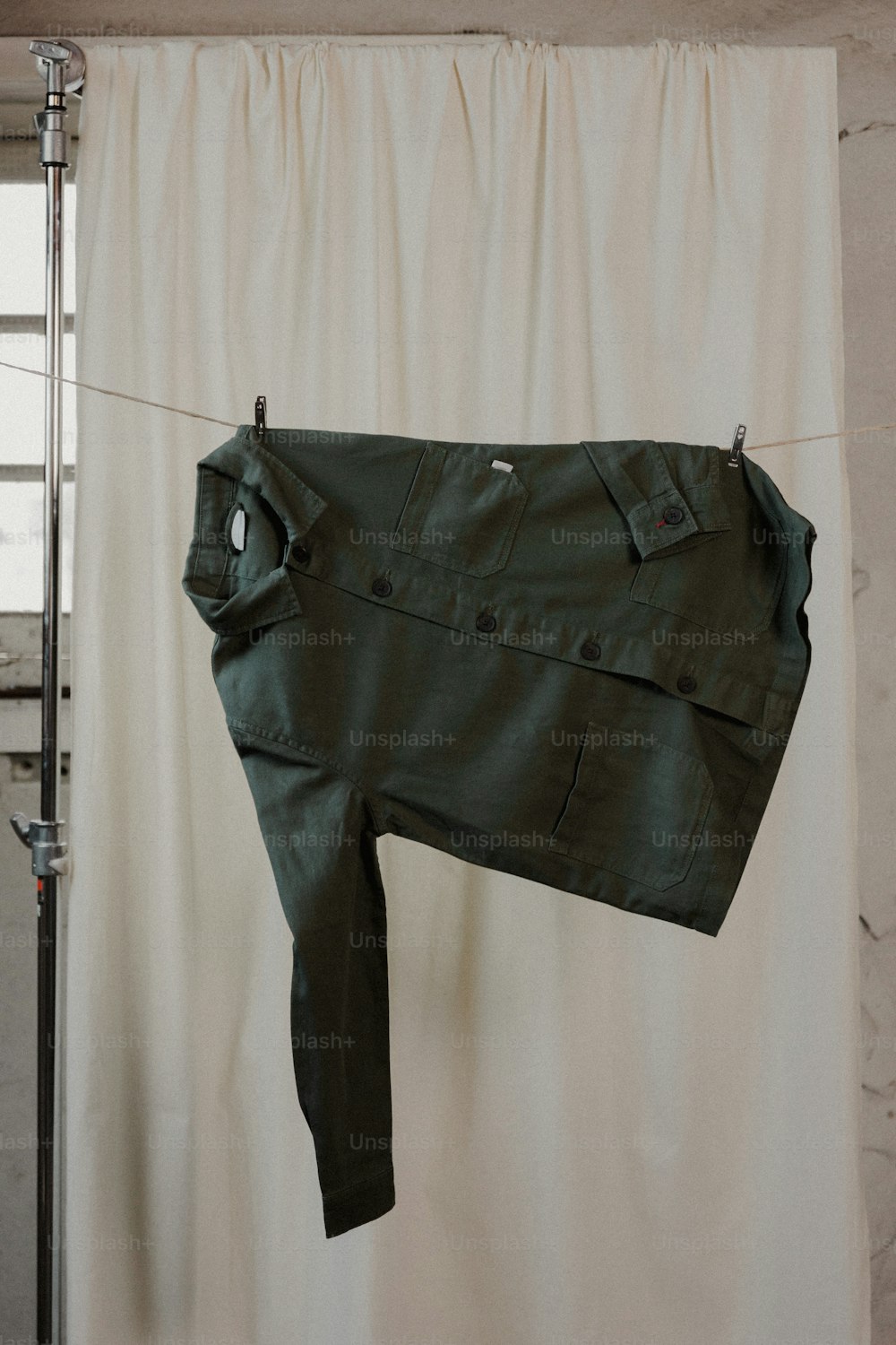 a pair of pants hanging on a clothes line