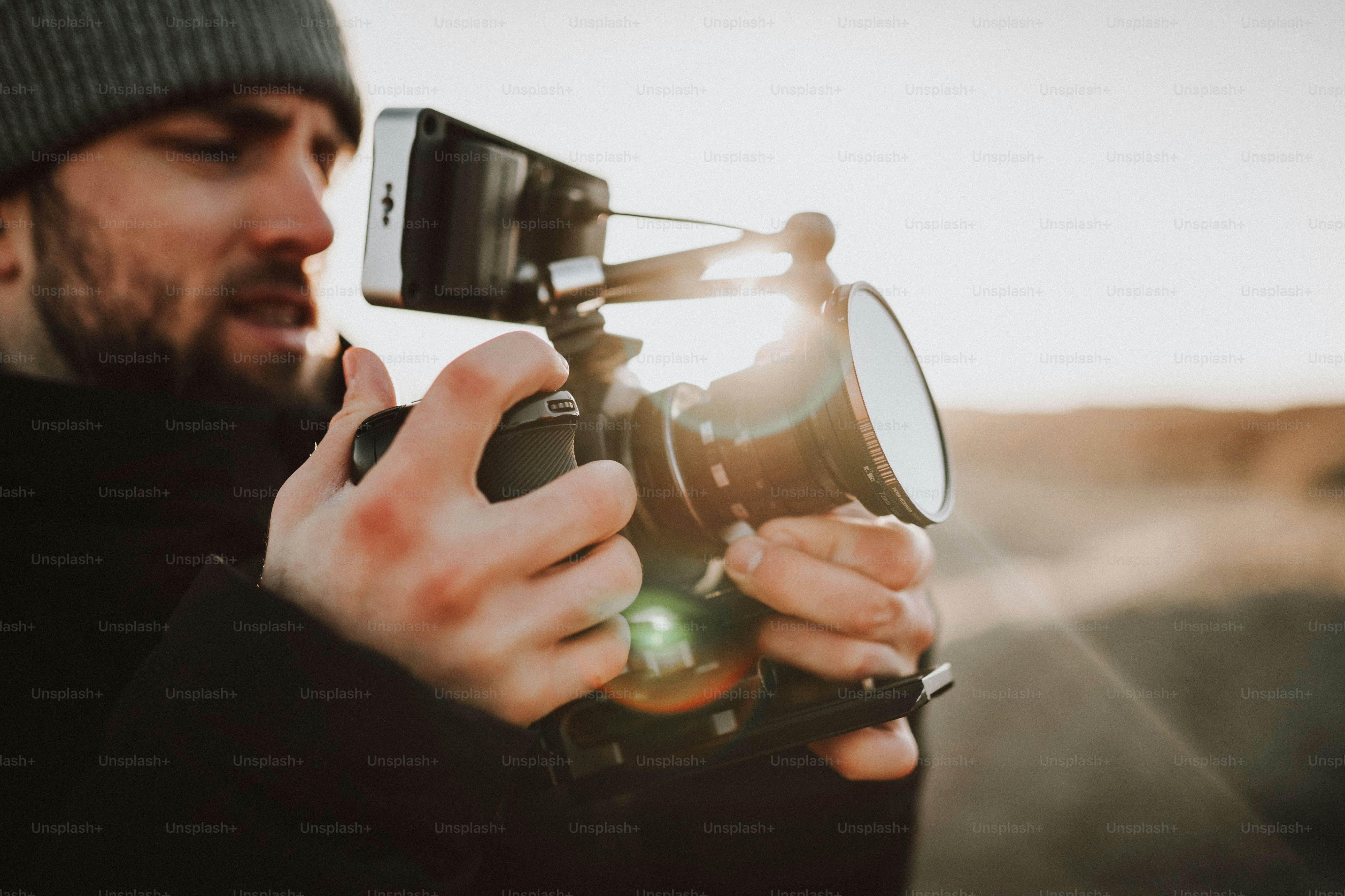 Camera operator getting the shots during sunrise
