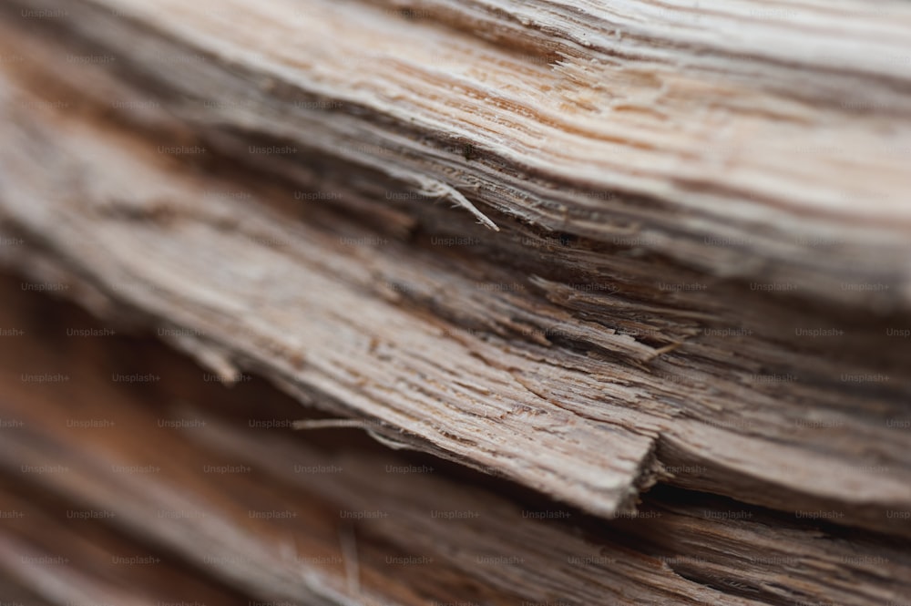 a close up of a stack of wood
