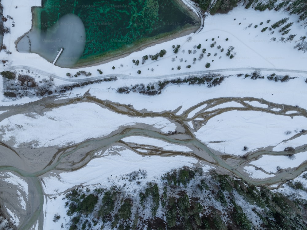 an aerial view of a snow covered area