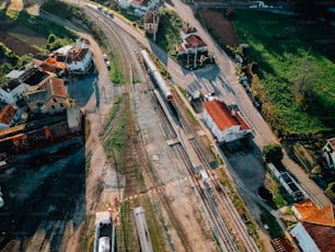 an aerial view of a train track and buildings