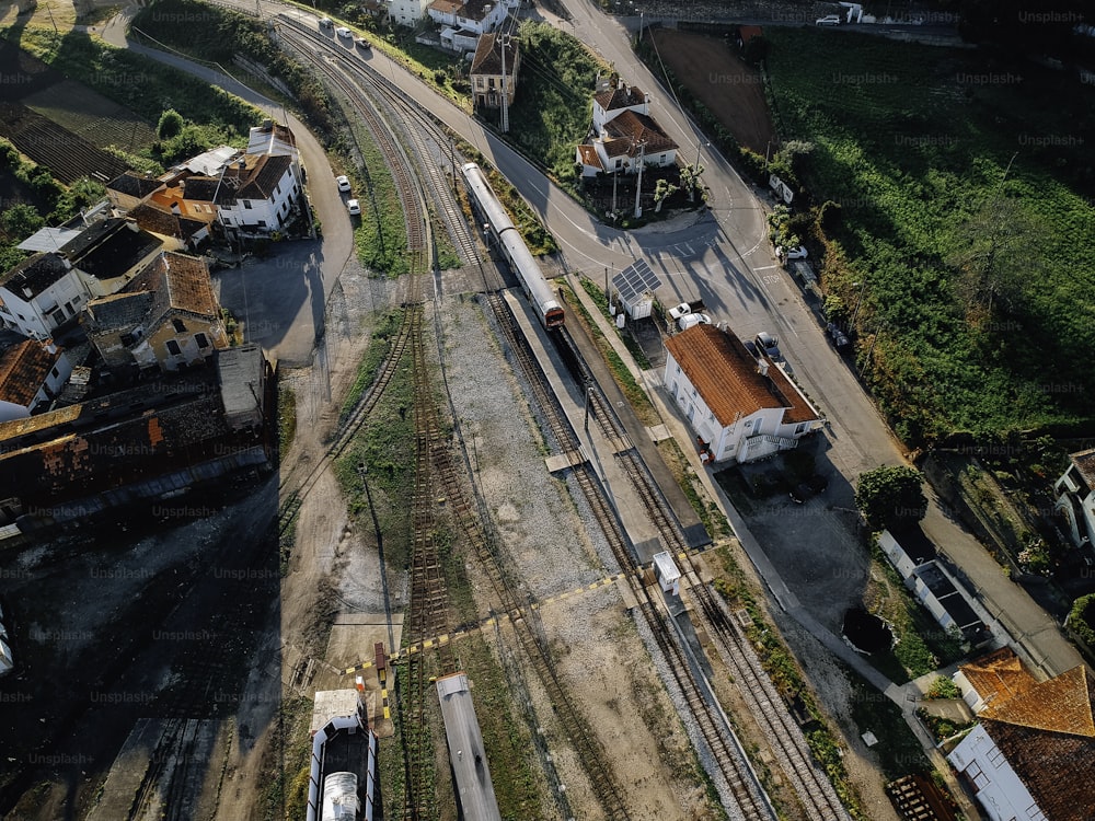 an aerial view of a train track and buildings