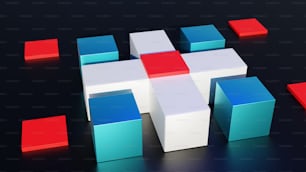 Un gruppo di cubi seduti sopra una superficie nera