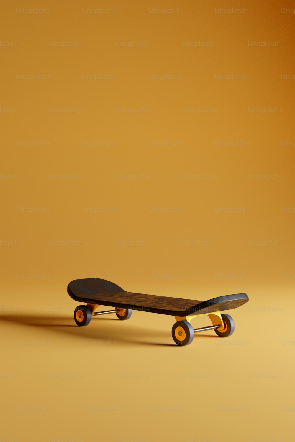 노란 바닥 위에 앉아 있는 스케이트보드