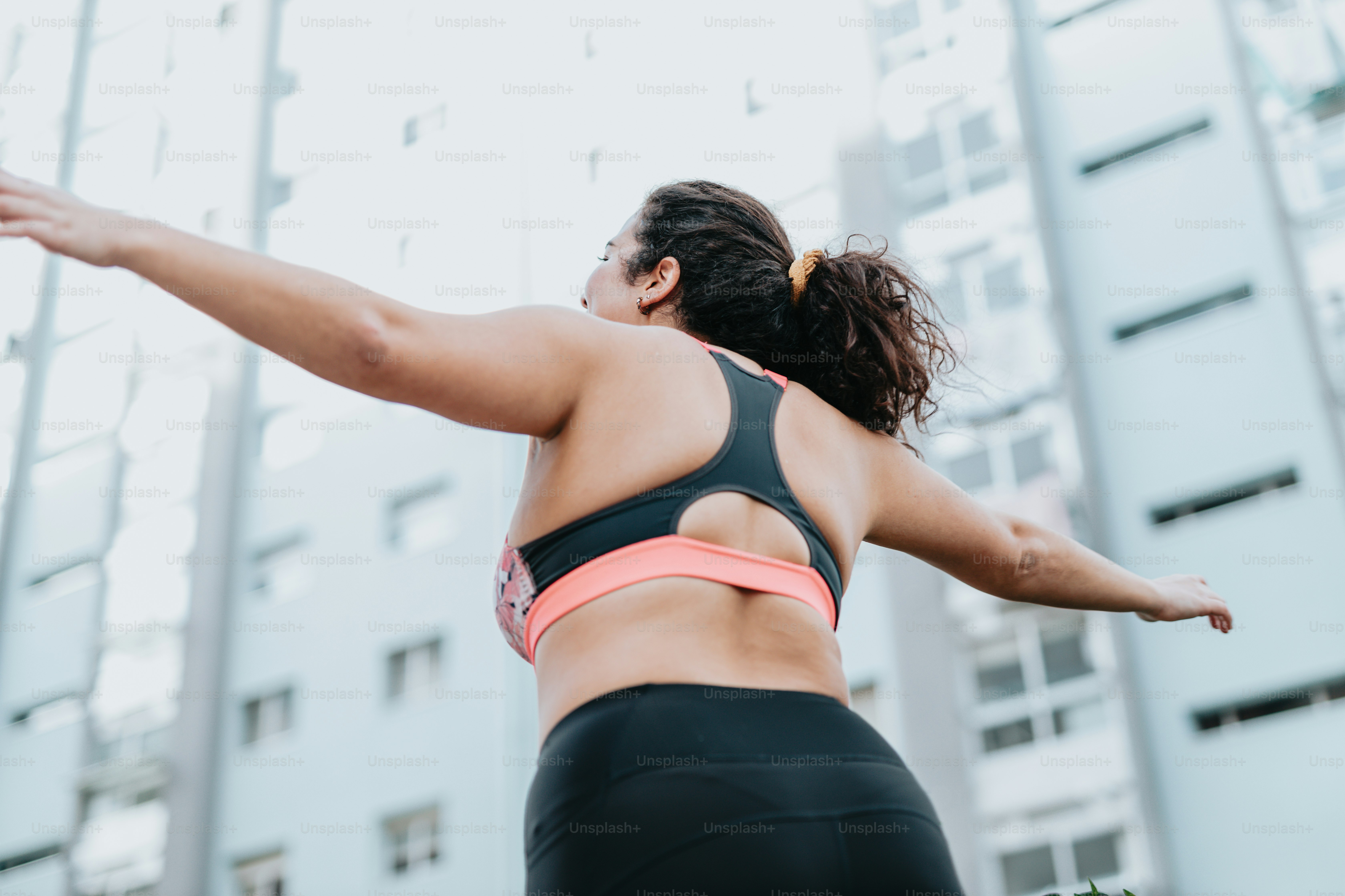 a woman in a sports bra top and black shorts