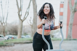 a woman in a sports bra holding a gym equipment