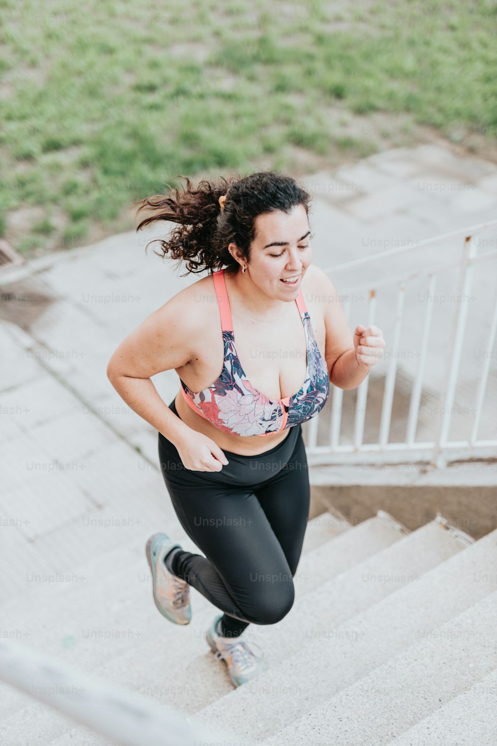 a woman running down a flight of stairs