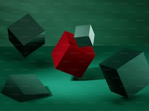 a group of black and red cubes on a green surface