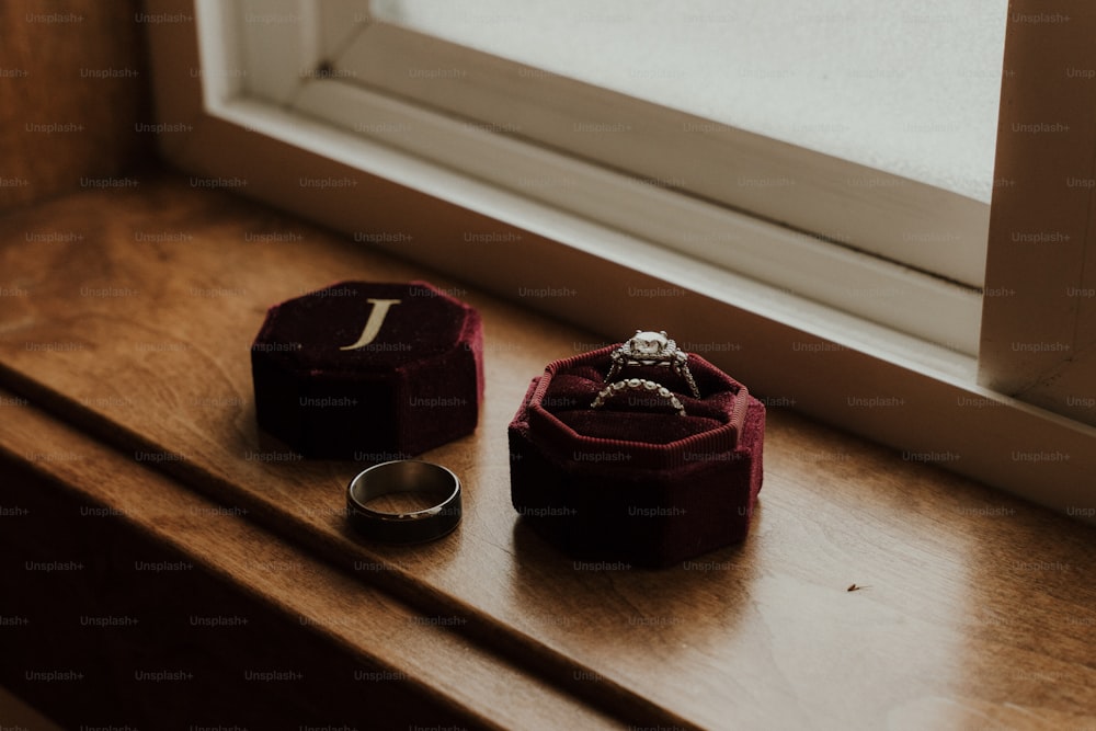 a couple of rings sitting on top of a wooden table