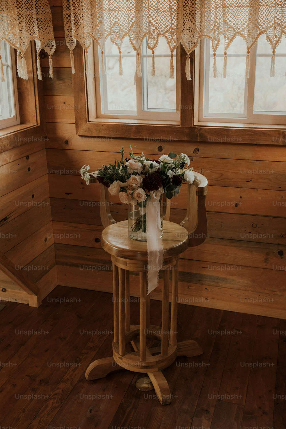 a table with a vase of flowers on top of it