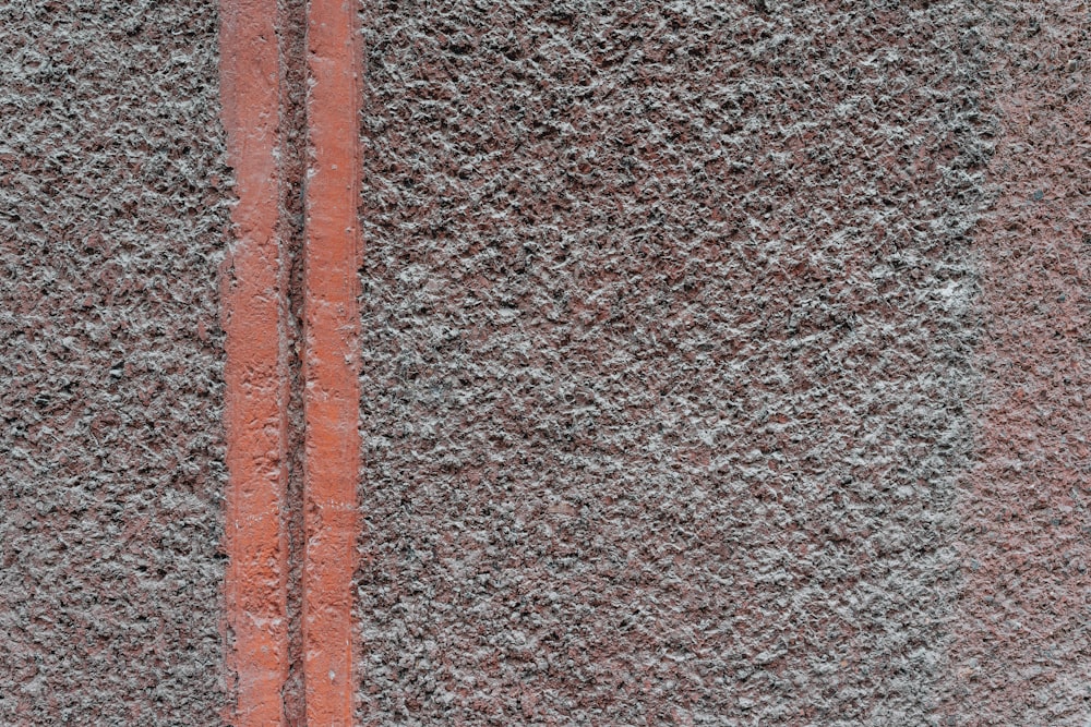 a close up of a street sign on a wall