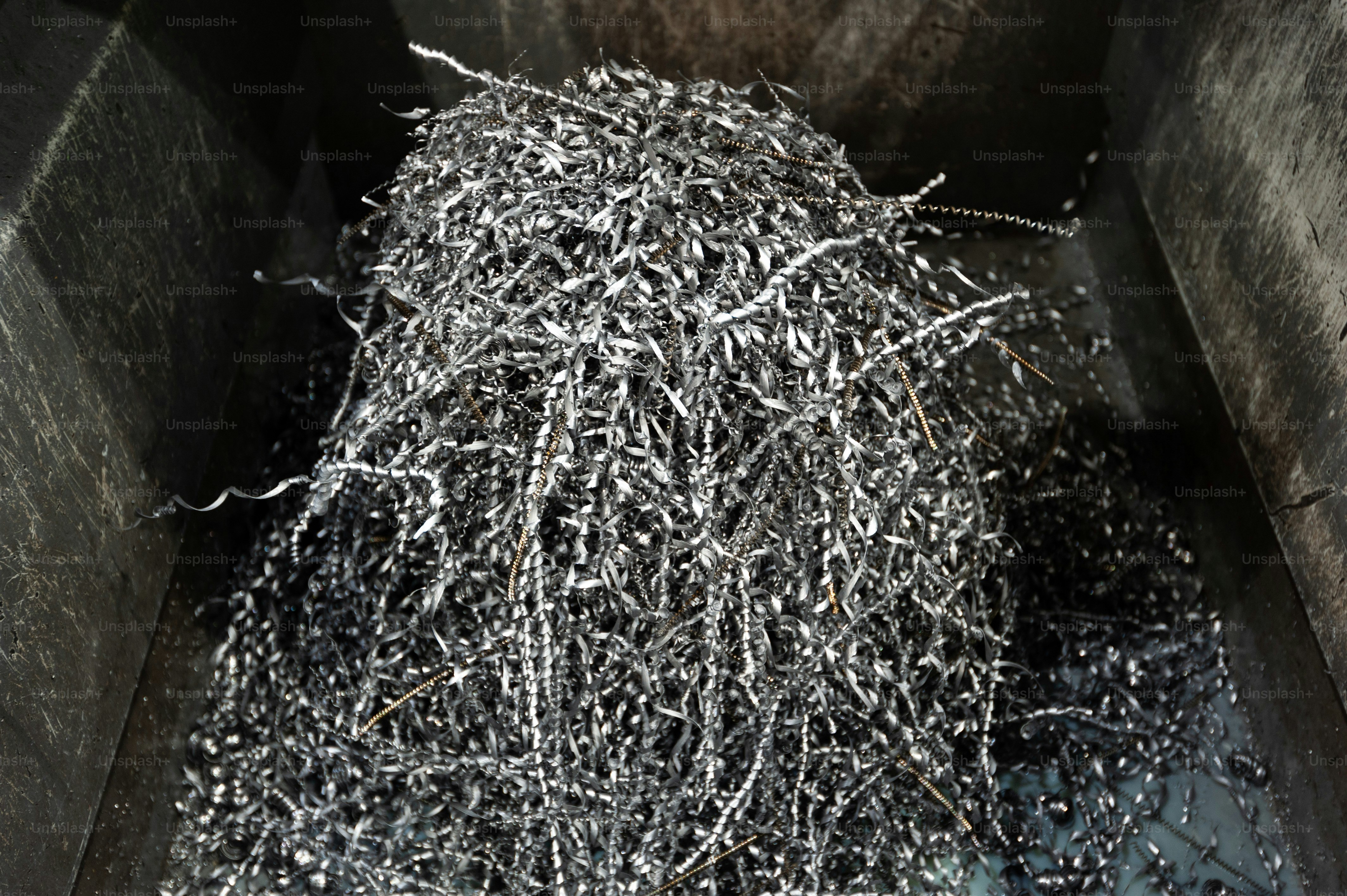 A pile of shredded metal in a bin photo Metal Image on Unsplash