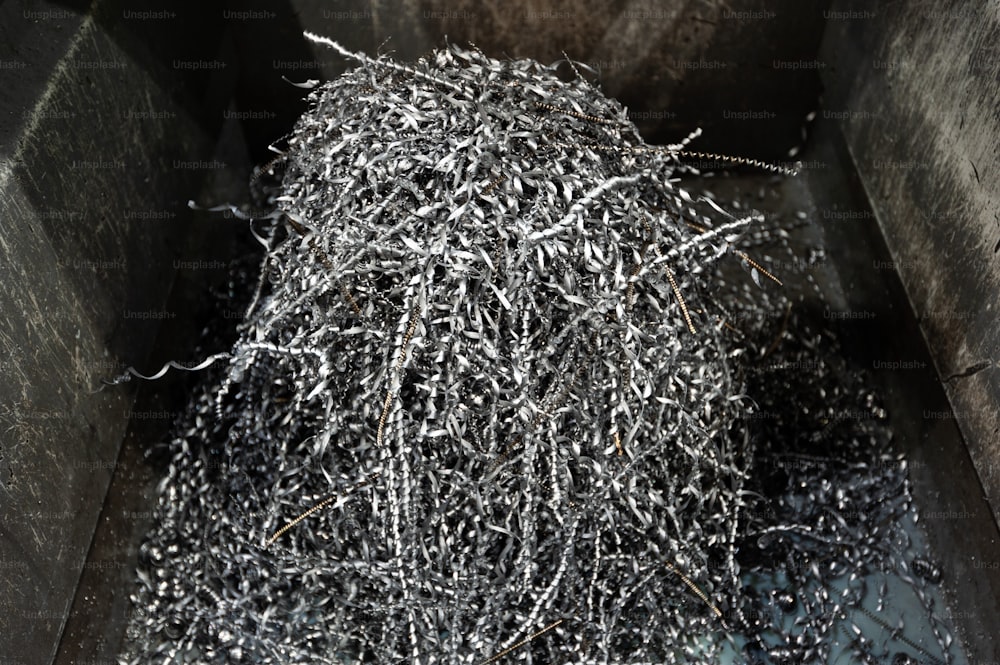 a pile of shredded metal in a bin