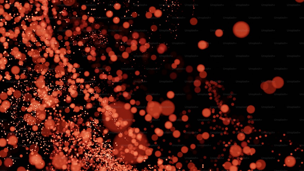 Ein verschwommenes Foto von roten Blasen auf schwarzem Hintergrund