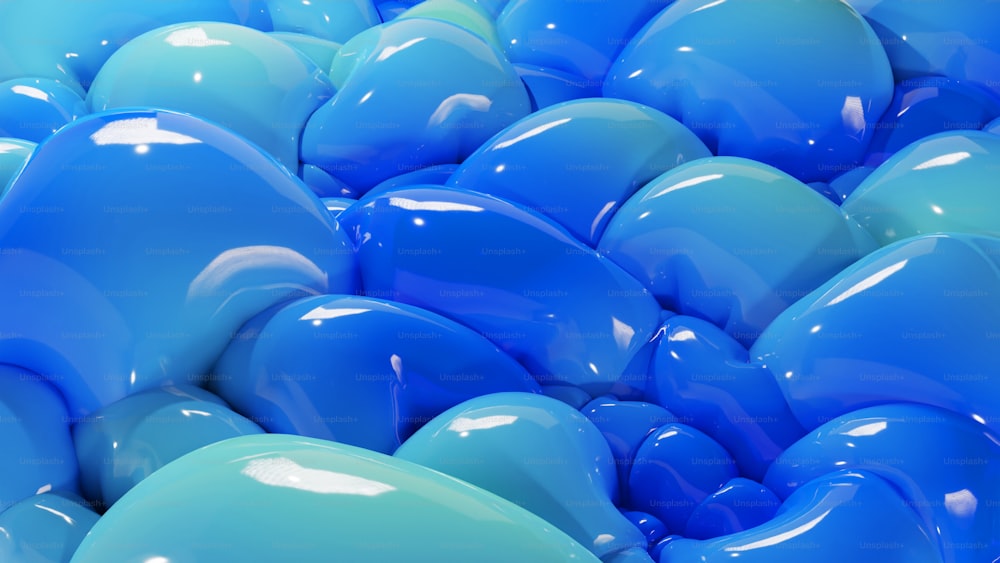 a large group of blue and green balloons