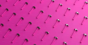 a bunch of screws that are on a pink surface