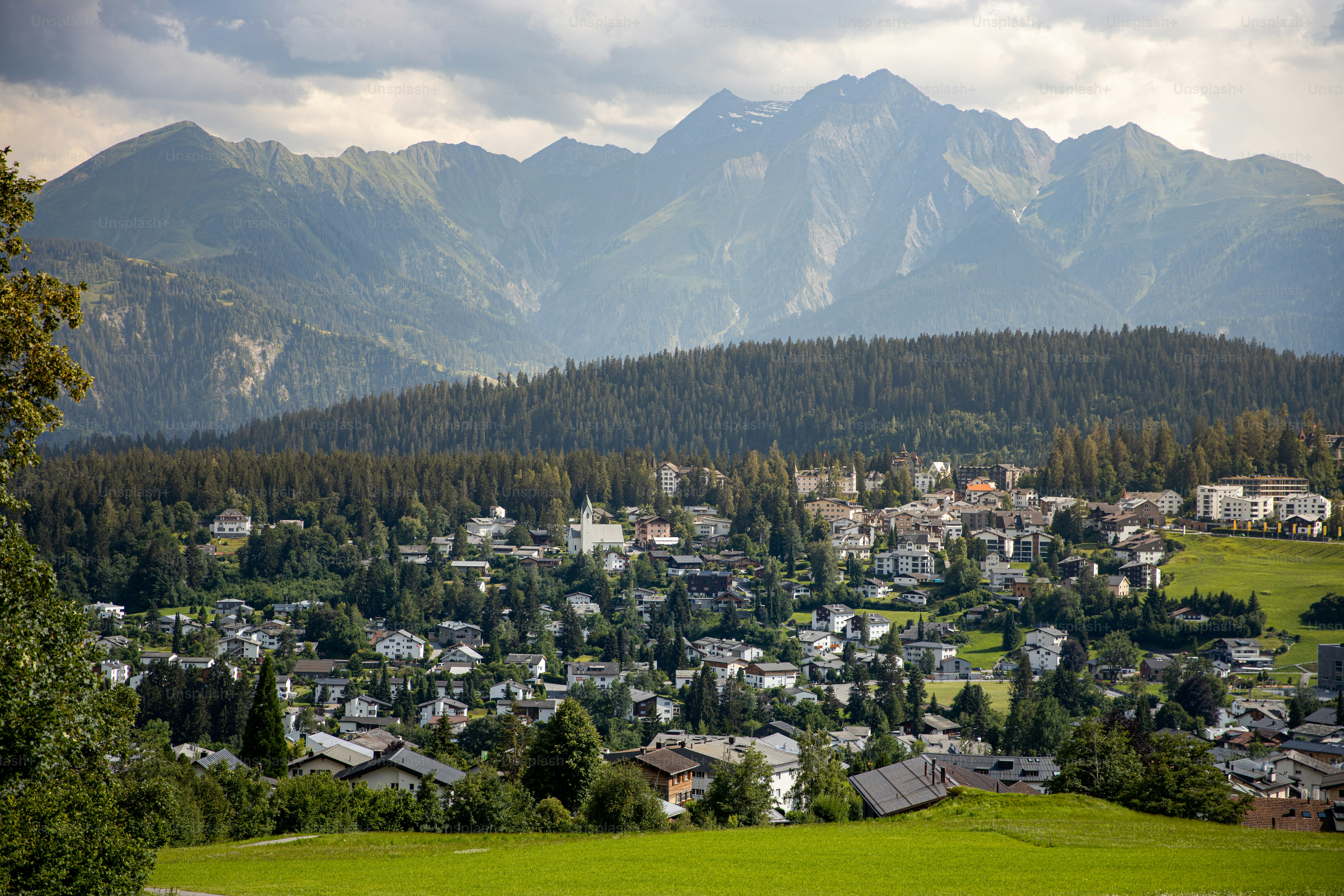 a town nestled in the mountains surrounded by trees