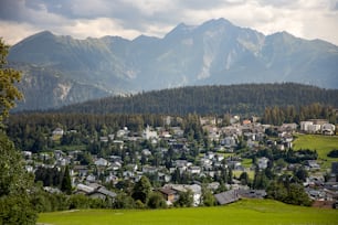 a town nestled in the mountains surrounded by trees