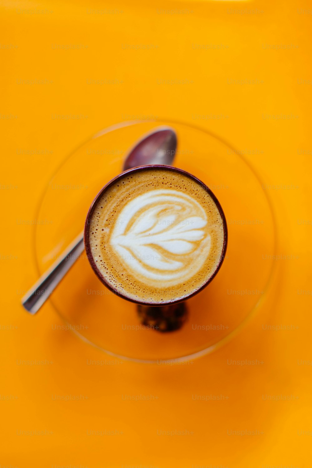 a cup of coffee with a spoon in it