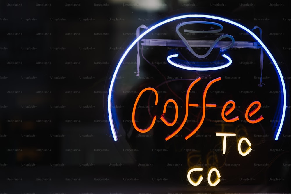 a neon sign that says coffee to go