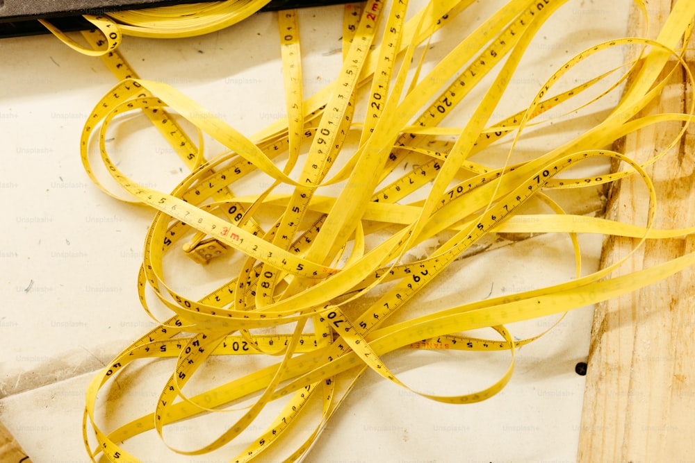 a pair of scissors and a pair of yellow tape