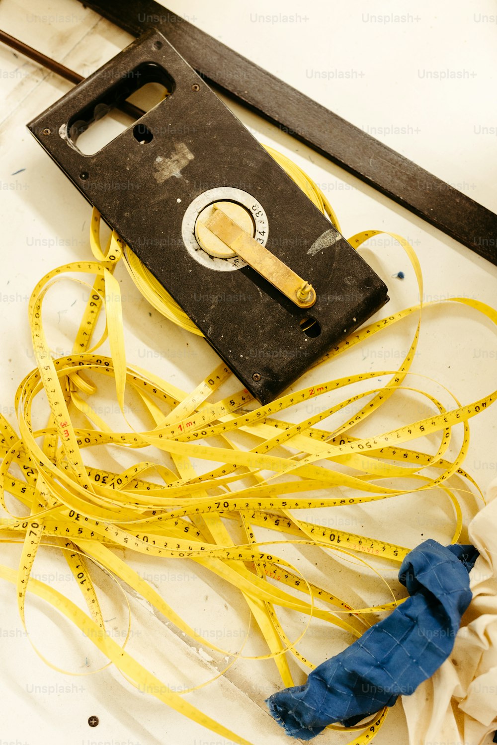 a measuring tape and a pair of scissors on a table