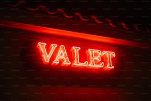 a red neon sign that says valet