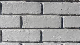 a close up of a white brick wall