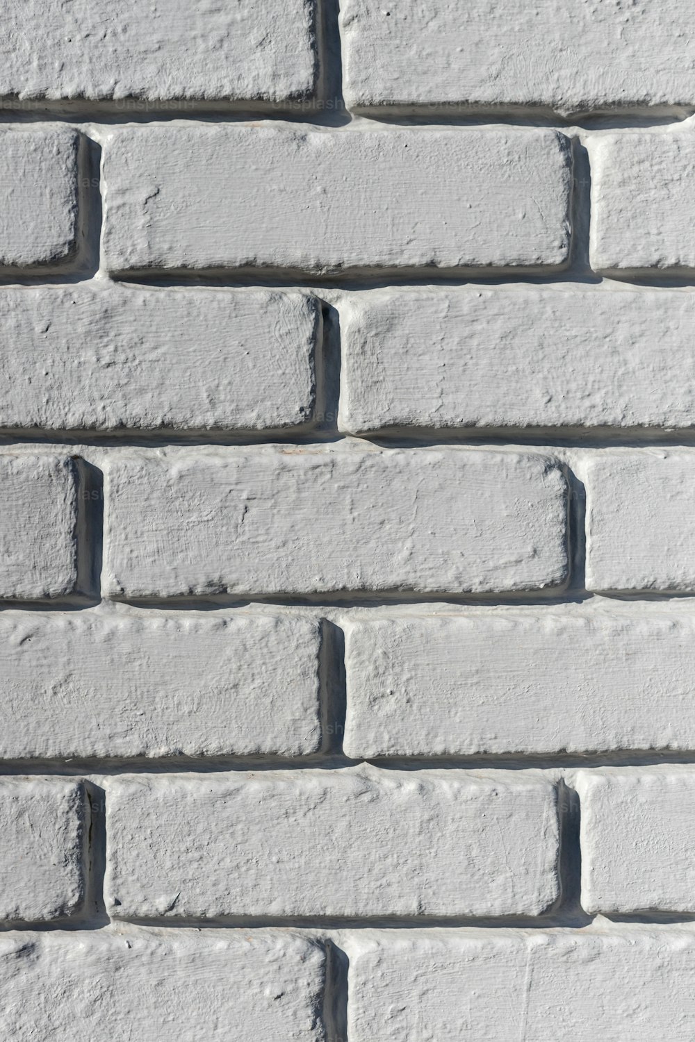 um close up de uma parede de tijolos brancos