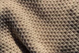 a close up of a blanket with a black and white pattern