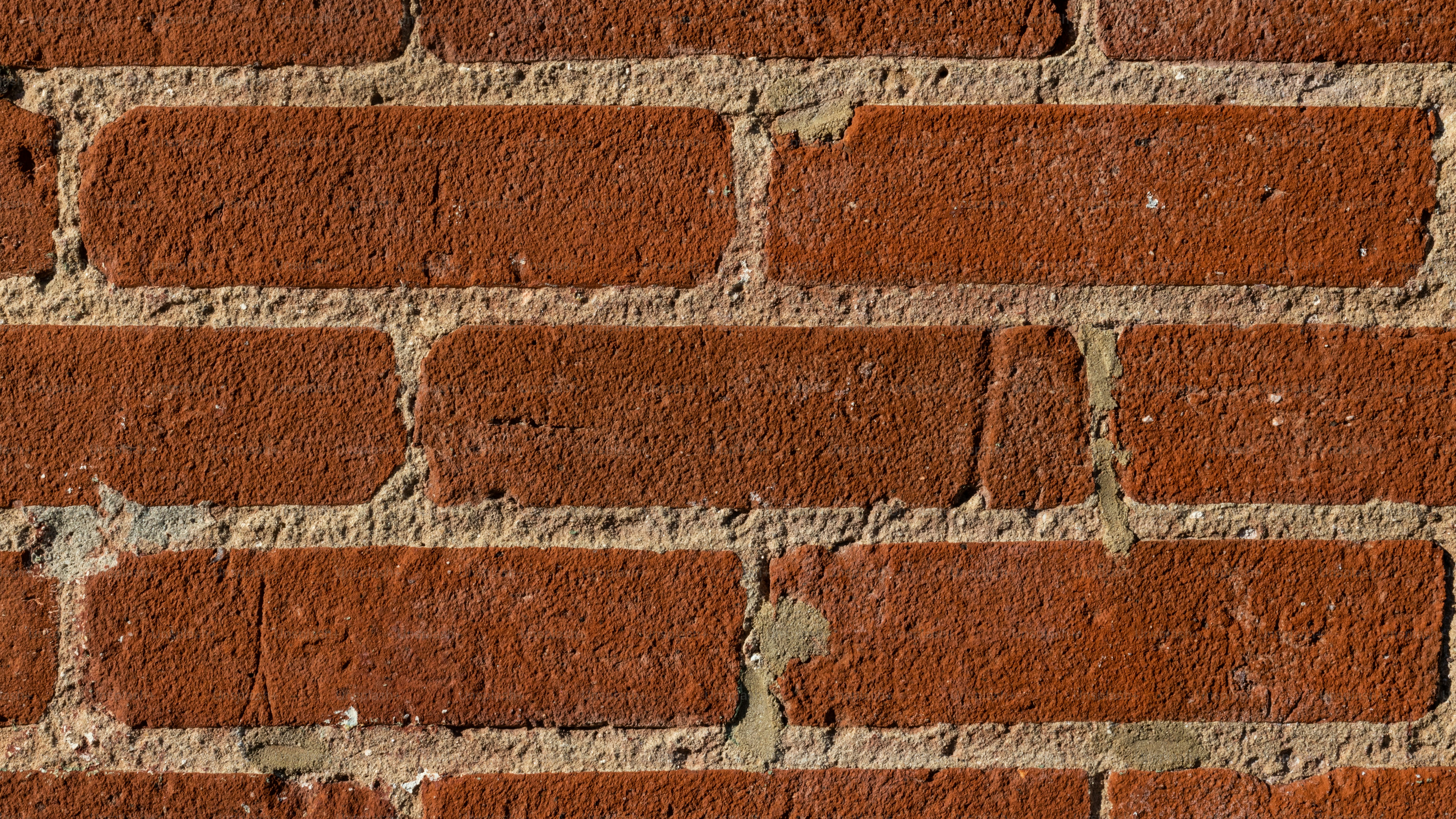 A close up of a brick wall made of red bricks photo Texture Image on