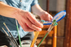 a close up of a person holding a toothbrush