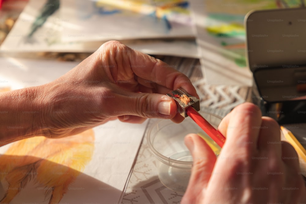 a person holding a pair of scissors in their hands