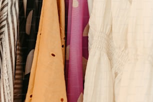 a rack of clothes hanging on a wall